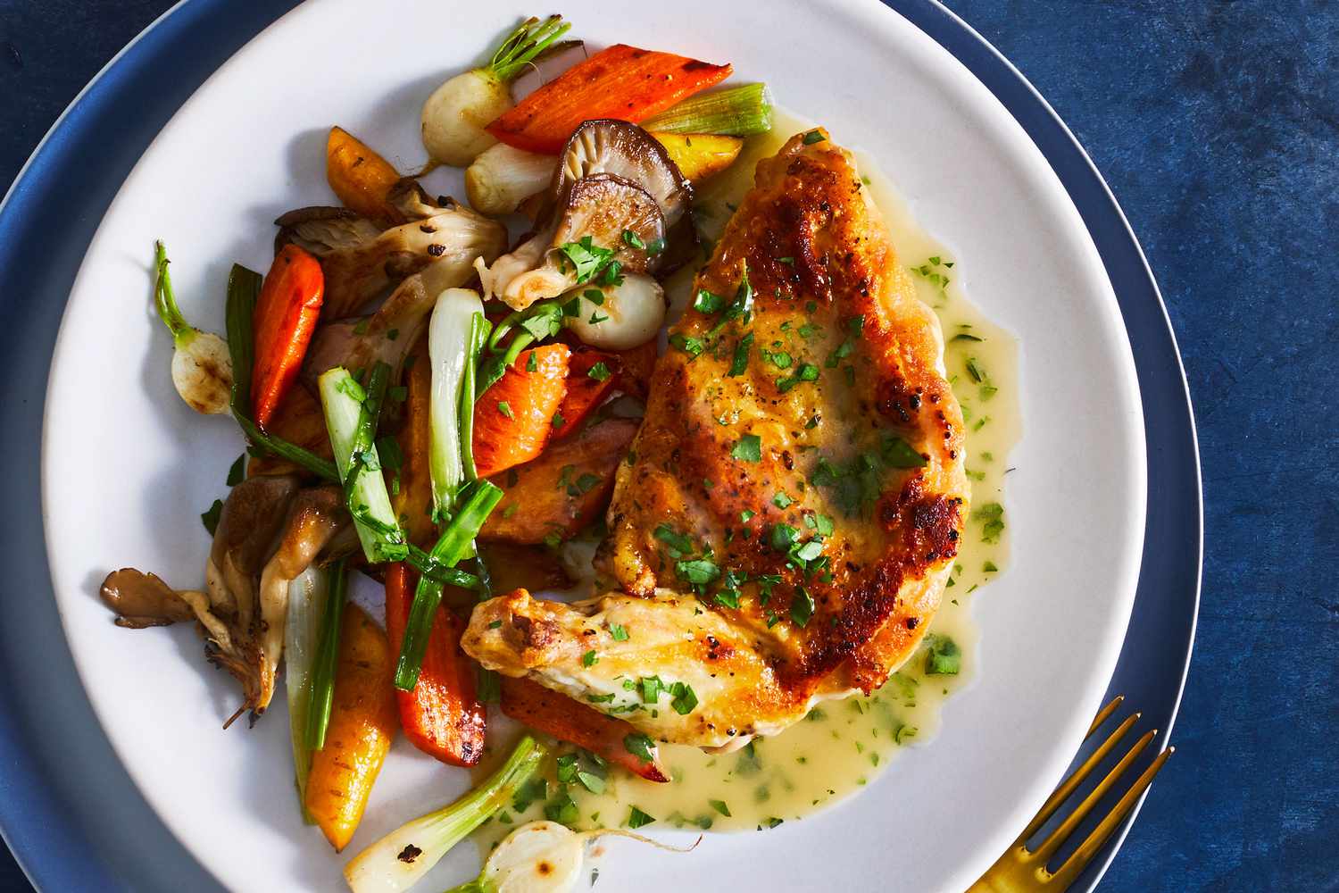 ## Roasted Chicken with Vegetables: A Flavorful and Nutritious Meal Roasted chicken with vegetables is a classic dish that is both delicious and easy to prepare. The combination of savory chicken and tender vegetables creates a satisfying and nutritious meal that is perfect for any occasion. ### Choosing the Right Chicken The key to a successful roasted chicken is to start with a high-quality bird. Look for a whole chicken that is free-range or organic if possible. A free-range or organic chicken will have a better flavor and texture than a factory-farmed bird. ### Preparing the Vegetables The vegetables you choose to roast with your chicken can vary depending on your personal preferences. Some popular choices include: * **Potatoes:** Russet potatoes are a classic choice for roasting. You can roast them whole or cut them into wedges. * **Carrots:** Carrots add a touch of sweetness to the dish. Roast them whole or cut them into sticks. * **Brussels sprouts:** Brussels sprouts are a healthy and flavorful vegetable that pairs well with roasted chicken. * **Onion:** Onion adds a savory flavor to the dish. * **Garlic:** Garlic is a must-have for any roasted chicken dish. ### Seasoning the Chicken and Vegetables Seasoning the chicken and vegetables is essential for a flavorful dish. You can use a simple seasoning blend of salt, pepper, and paprika, or you can get more creative with your seasonings. Some other popular seasonings for roasted chicken include: * **Herbs:** Rosemary, thyme, and oregano are all great choices for roasted chicken. * **Spices:** Cumin, paprika, and chili powder can add a touch of heat to the dish. * **Citrus:** Lemon or orange zest can add a bright and tangy flavor to the chicken. ### Roasting the Chicken and Vegetables The best way to roast chicken and vegetables is to place them on a rack in a roasting pan. This will allow the heat to circulate around the chicken and vegetables, resulting in a crispy skin and tender meat. Once the chicken and vegetables are seasoned, place them in the roasting pan. Roast the chicken and vegetables in a preheated oven at 400°F (200°C) for 45-50 minutes, or until the chicken is cooked through. ### Serving Roasted Chicken with Vegetables Roasted chicken with vegetables is a versatile dish that can be served in many different ways. You can serve it with a side of rice, pasta, or a salad. Or, you can serve it as a main course with a variety of sides, such as mashed potatoes, roasted vegetables, or a gravy. ### Tips for Roasting Chicken with Vegetables * **For a crispier skin, try air-frying the chicken before roasting it.** Air-frying can help to remove excess moisture from the skin, allowing it to crisp up more quickly. * **If you're short on time, you can use pre-cut vegetables.** This can save you time and effort, especially if you're not a fan of chopping vegetables. * **For a heartier meal, add a cup of chicken broth to the roasting pan.** The broth will help to keep the chicken and vegetables moist and flavorful. * **Leftover roasted chicken can be used in sandwiches, soups, or salads.** Roasted chicken is a great way to add protein and flavor to any meal. ### Additional Variations * **For a Mediterranean twist, add olives, feta cheese, and dried oregano to the roasting pan.** This will give the dish a flavorful Mediterranean flavor. * **For a Mexican-inspired meal, add chili powder, cumin, and lime juice to the seasoning mix.** This will give the dish a spicy and tangy flavor. * **For a sweet and savory combination, drizzle the roasted chicken with honey or maple syrup before serving.** This will add a touch of sweetness to the dish. Roasted Chicken with Vegetables